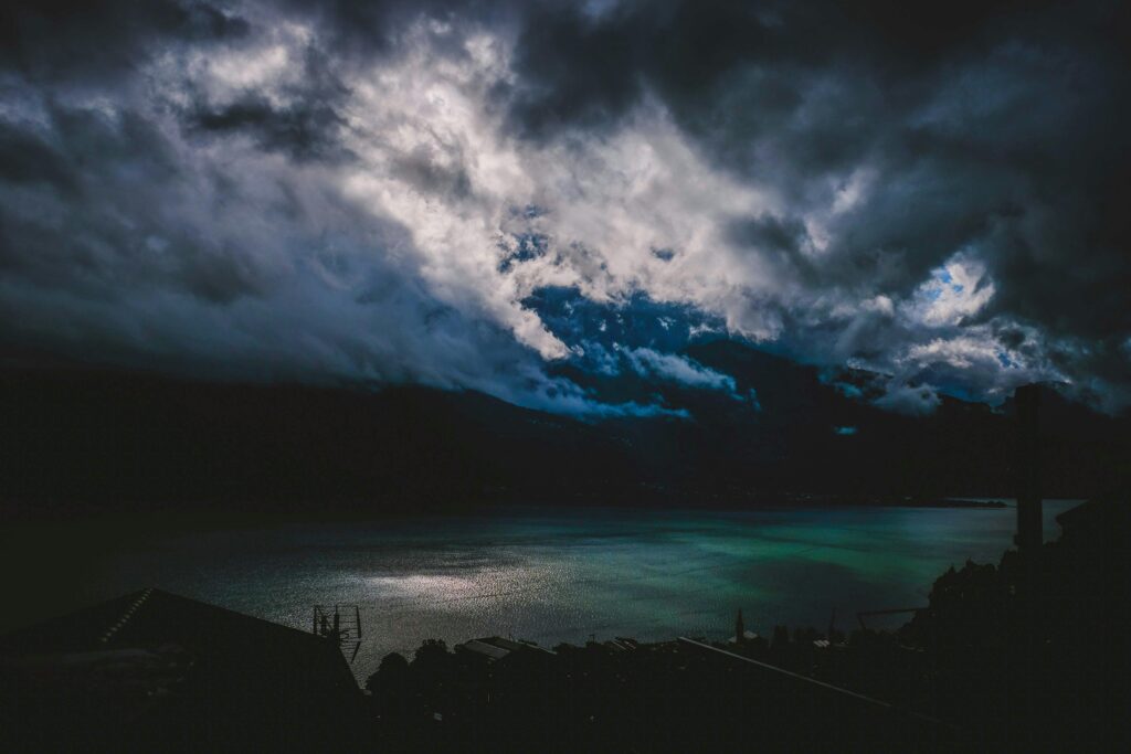 pexels photo 5398765 5398765 Dark clouds hover over Lake Como, creating a dramatic and serene landscape.